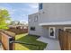 Backyard featuring lawn, landscaping, and access to the modern home at 2008 S Galapago St, Denver, CO 80223