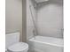Bright bathroom showcases a bathtub with gray tiling and a modern shower head at 2008 S Galapago St, Denver, CO 80223