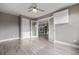 Spacious bedroom with sleek floors, ceiling fan, and bright white trim at 2008 S Galapago St, Denver, CO 80223