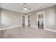Spacious main bedroom with ceiling fan, neutral walls, and walk-in closet at 2008 S Galapago St, Denver, CO 80223