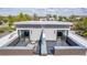 Rooftop deck with furniture, a brick railing, and a great view at 2008 S Galapago St, Denver, CO 80223