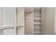 Well-organized walk-in closet with ample shelving and hanging space for optimal storage at 2008 S Galapago St, Denver, CO 80223
