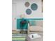Basement living area showcases stylish furniture, decorative art, and a modern side table with lamp at 6600 E Mississippi Ave # 7, Denver, CO 80224