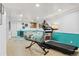 Spacious finished basement with a treadmill and inviting seating area perfect for relaxation and fitness at 6600 E Mississippi Ave # 7, Denver, CO 80224