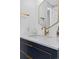 Beautiful bathroom vanity with a gold faucet and neutral color tones at 6600 E Mississippi Ave # 7, Denver, CO 80224