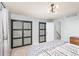 Bedroom featuring a modern light fixture and a view of the closet at 6600 E Mississippi Ave # 7, Denver, CO 80224