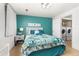 Bright bedroom featuring seaside decor and en-suite laundry room at 6600 E Mississippi Ave # 7, Denver, CO 80224