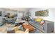 Open-concept living area with modern furnishings, hardwood floors, and decorative accents at 6600 E Mississippi Ave # 7, Denver, CO 80224