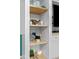 Close-up of built-in shelves displaying nautical-themed décor adding a touch of personality at 6600 E Mississippi Ave # 7, Denver, CO 80224