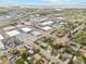 Overhead view featuring suburban homes, commercial buildings and a highway with the Rocky mountains in the background at 320 Orion St, Golden, CO 80401