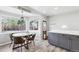 Kitchen dining area with a view features a wood table, four chairs, and gray cabinetry at 320 Orion St, Golden, CO 80401