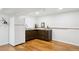 Compact kitchenette with sink, cabinets, and a modern countertop at 320 Orion St, Golden, CO 80401