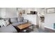 Bright living room featuring hardwood floors, comfortable seating, and open access to the kitchen at 320 Orion St, Golden, CO 80401