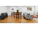 Inviting living room area featuring hardwood floors, dining table, sofa, and stylish decor at 320 Orion St, Golden, CO 80401
