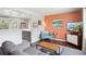 Open living room featuring hardwood floors, stylish decor, and seamless flow to the kitchen at 320 Orion St, Golden, CO 80401