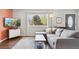 Comfortable living room featuring hardwood floors, a large window, and cozy decor at 320 Orion St, Golden, CO 80401