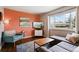 Bright living room featuring hardwood floors, a large window, and comfortable seating at 320 Orion St, Golden, CO 80401
