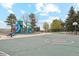 Inviting playground with colorful play structures and basketball court offers a space for community activities at 320 Orion St, Golden, CO 80401