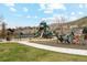 Community playground features multiple slides and climbing structures, with picnic tables and other recreation equipment at 320 Orion St, Golden, CO 80401
