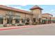 A Whole Foods storefront is shown with umbrellas, outdoor seating, and parking on a sunny day at 320 Orion St, Golden, CO 80401