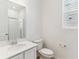 Clean, bright bathroom with a glass-enclosed shower, white vanity, and modern fixtures at 449 S Salida St, Aurora, CO 80017