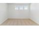Sunlit bedroom featuring neutral carpeting and three evenly spaced windows providing lots of natural light at 449 S Salida St, Aurora, CO 80017