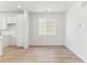 Cozy dining area featuring light hardwood floors and a large window at 449 S Salida St, Aurora, CO 80017