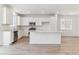 Modern kitchen with stainless steel appliances, white cabinets, and a spacious island at 449 S Salida St, Aurora, CO 80017