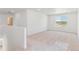 Spacious living room with plush carpeting, recessed lighting, and a large window with natural light at 449 S Salida St, Aurora, CO 80017