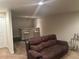 Spacious basement with a wet bar, modern seating, plush carpet, and ample lighting at 15501 E 112Th Ave # 28E, Commerce City, CO 80022
