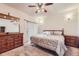 A primary bedroom features neutral walls, carpet, and a slider to the outside at 15501 E 112Th Ave # 28E, Commerce City, CO 80022