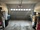 Spacious garage with abundant storage options and natural light pouring in from the main door at 15501 E 112Th Ave # 28E, Commerce City, CO 80022