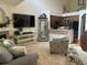 Inviting living room with a fireplace, large TV, and open access to the kitchen at 15501 E 112Th Ave # 28E, Commerce City, CO 80022