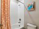 Bathroom featuring a tub and shower combination with polka dot shower curtain and white subway tiles at 7240 S White Crow Way, Aurora, CO 80016