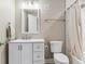 Functional bathroom featuring a toilet, shower and vanity with a mirror at 7240 S White Crow Way, Aurora, CO 80016
