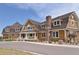 Exterior view of community clubhouse showcasing its attractive design, inviting entrance, and well-maintained landscaping at 7240 S White Crow Way, Aurora, CO 80016