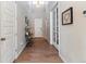 Inviting foyer with hardwood floors, console table, and natural light at 7240 S White Crow Way, Aurora, CO 80016