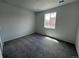 Bedroom features carpet, neutral walls, and a window at 6599 N Netherland St, Aurora, CO 80019