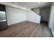 Bright living room features hardwood floors, neutral walls, and lots of natural light at 6599 N Netherland St, Aurora, CO 80019