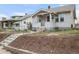 Charming home featuring a covered front porch and a well-maintained yard at 3226 S Grant St, Englewood, CO 80113