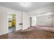 Open concept living room with attached shelving unit at 3226 S Grant St, Englewood, CO 80113