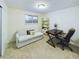 Bright bedroom with a cozy couch, desk, and ample lighting at 4667 Ashfield Dr, Boulder, CO 80301