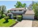 Charming two story home with an attached two car garage, manicured landscaping and a well maintained lawn at 4667 Ashfield Dr, Boulder, CO 80301