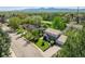 Charming home with mature trees, an attached two car garage, and a well manicured lawn, exuding curb appeal and comfort at 4667 Ashfield Dr, Boulder, CO 80301