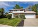 Charming two-story home with a manicured lawn and well-maintained landscaping at 4667 Ashfield Dr, Boulder, CO 80301