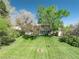 Charming home nestled among mature trees, set back on a well manicured lawn, creating a peaceful and private setting at 4667 Ashfield Dr, Boulder, CO 80301