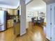 Open kitchen and dining area with stainless appliances and modern decor at 4667 Ashfield Dr, Boulder, CO 80301