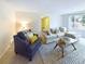 Inviting living room with a large window, comfortable seating, and stylish decor at 4667 Ashfield Dr, Boulder, CO 80301