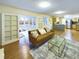 Cozy living room flowing into a kitchen with stainless steel appliances and a sunroom at 4667 Ashfield Dr, Boulder, CO 80301