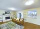 Bright living room featuring a fireplace, built-in shelving, and sliding glass doors leading to the patio at 4667 Ashfield Dr, Boulder, CO 80301